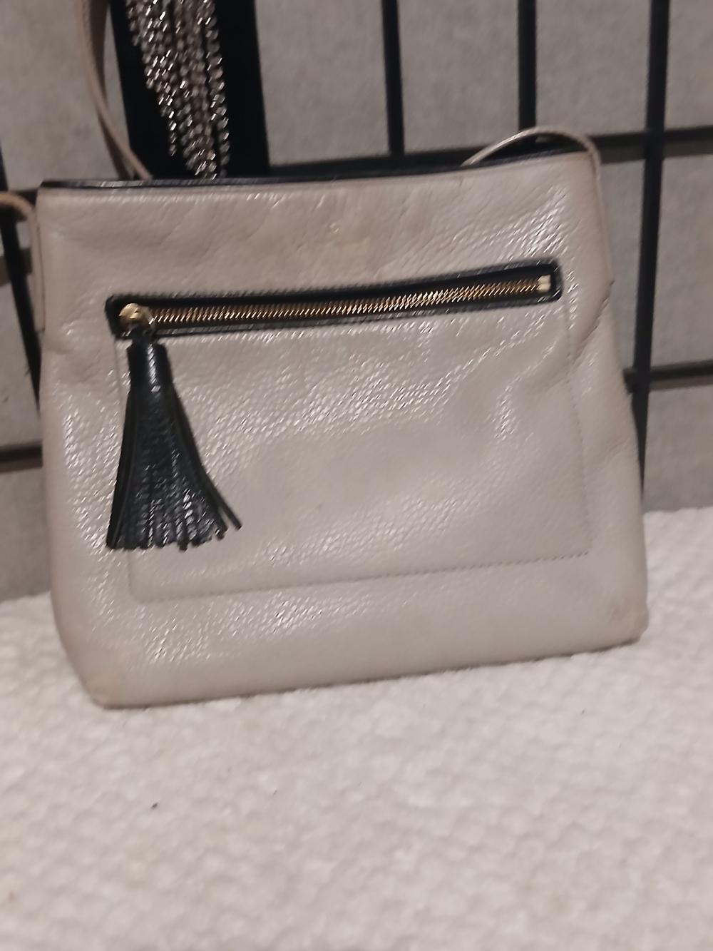 Kate Spade Women's Cream Crossbody Bag with Black Tassel Accent